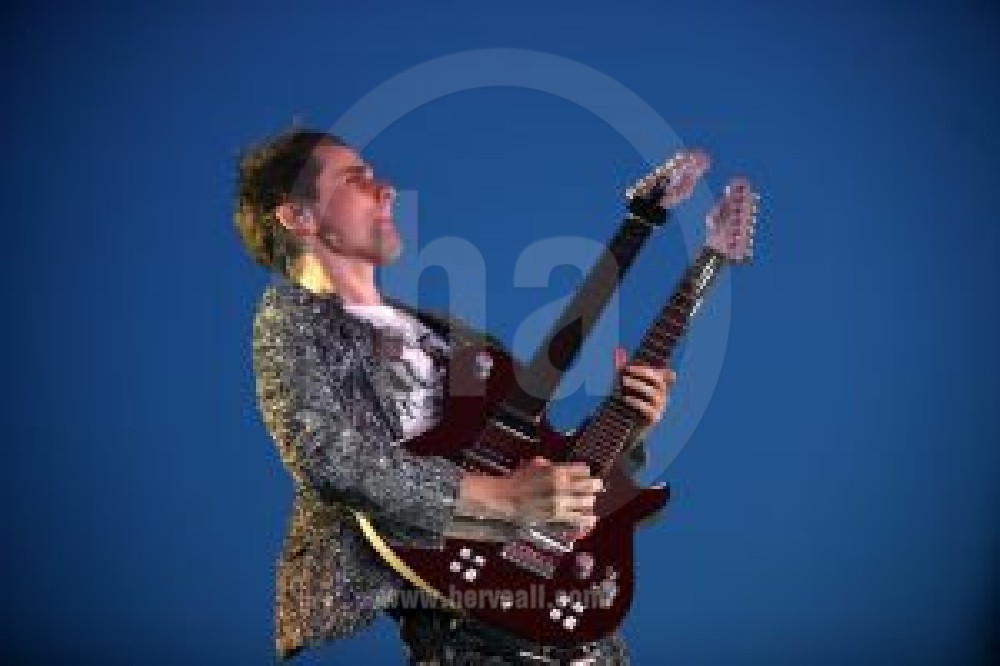 Matthew Bellamy with twin neck guitar