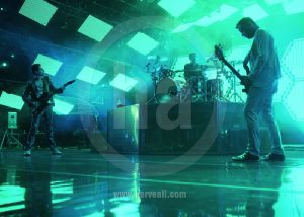 Muse band performing on stage