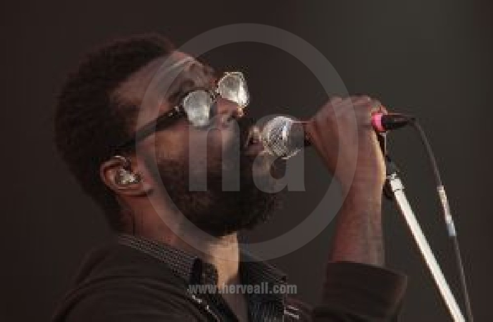 Tunde Adebimpe performing